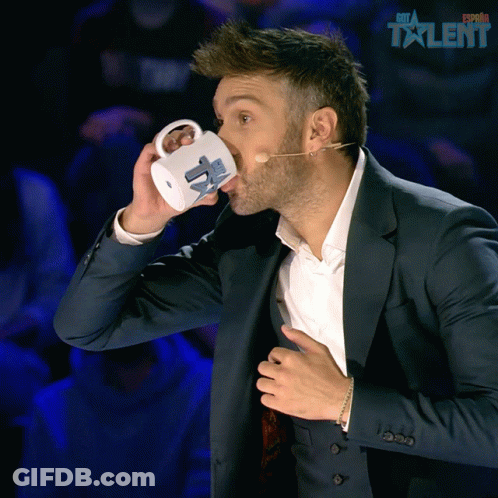 Man In Suit Drinking Espana Talent Mug GIF
