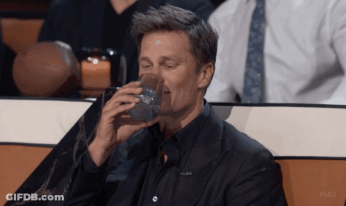 Man In Suit Drinking From Glass With Pika GIF