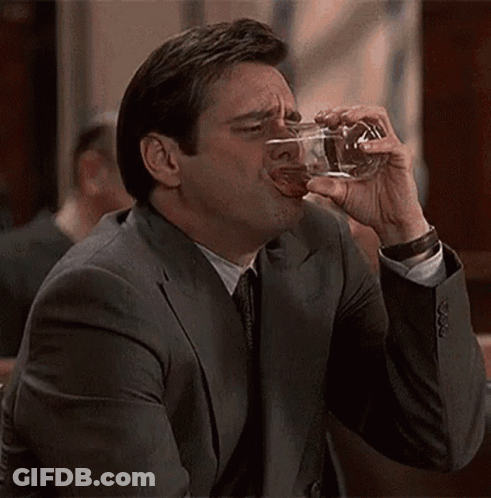 Man In Suit Drinking Glass GIF