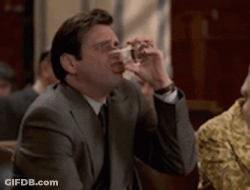 Man In Suit Drinking Glass GIF