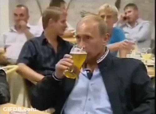 Man In Suit Drinking Glass Of Beer GIF