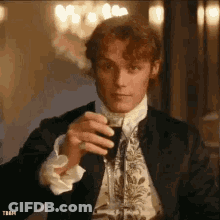 Man In Suit Drinking Glass Of Wine GIF