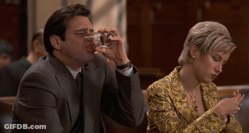Man In Suit Drinking Glass Woman On Phone GIF