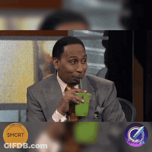 Man In Suit Drinking Green Cup Through Straw GIF