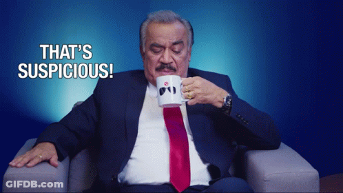 Man In Suit Drinking Suspicious Mug GIF