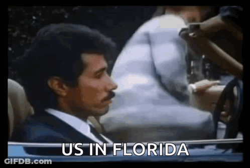 Man In Suit Driving Car Saying Us In Florida GIF