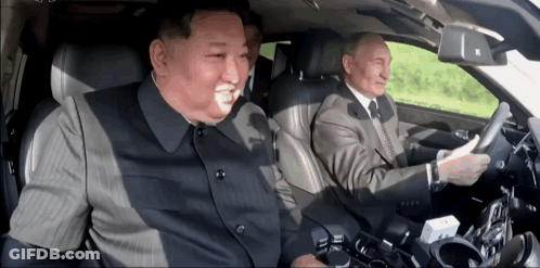 Man In Suit Driving Car With Another Man GIF