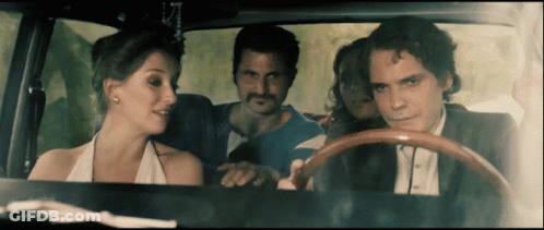 Man In Suit Driving Car With Woman In Back Seat GIF