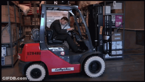 Man In Suit Driving Red Forklift 1178488 GIF