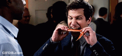 Man In Suit Eating Carrot GIF
