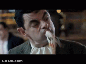 Man In Suit Eating Food GIF