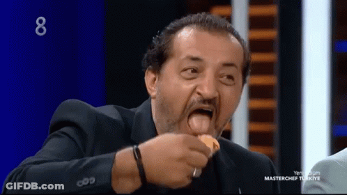 Man In Suit Eating On MasterChef Turkey Show GIF