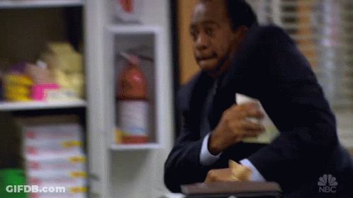 Man In Suit Eating Sandwich GIF