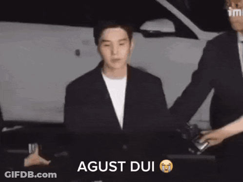 Man In Suit Escorted Saying Agust Dui GIF