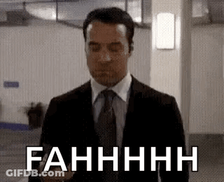 Man In Suit Eyes Closed Saying Fahhhh GIF