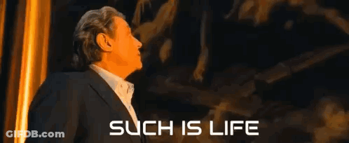 Man In Suit Facing Such Is Life Wall GIF