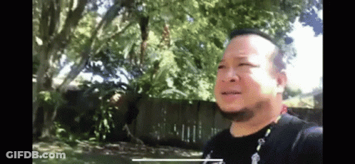 Man In Suit Fighting Another Man In Wrestling Match GIF