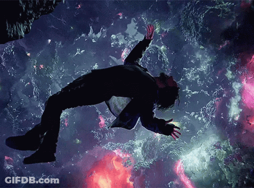 Man In Suit Floating With Arms Outstretched GIF