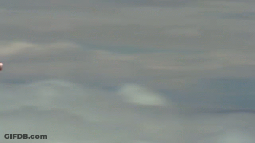 Man In Suit Flying With Chest Rocket GIF