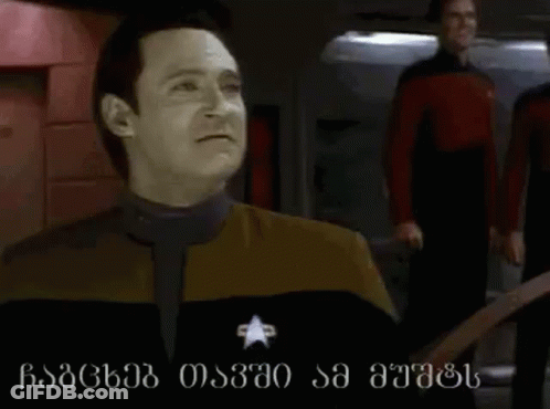 Man In Suit Funny Face Next To Another Man GIF