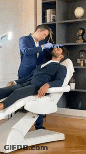 Man In Suit Getting Facial Treatment GIF