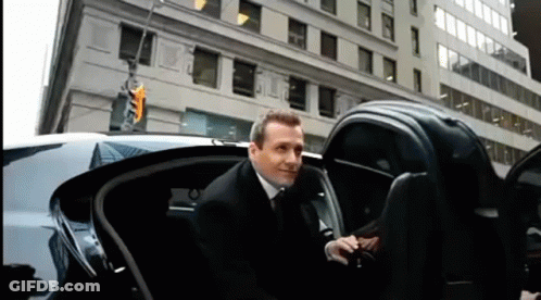 Man In Suit Getting Out Of Limousine GIF