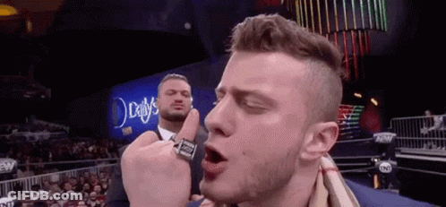 Man In Suit Giving Middle Finger To Another Man GIF