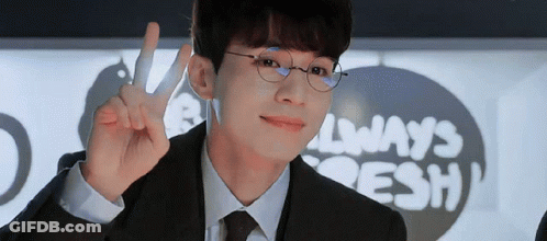 Man In Suit Giving Peace Sign In Front Of Always Fresh Sign GIF