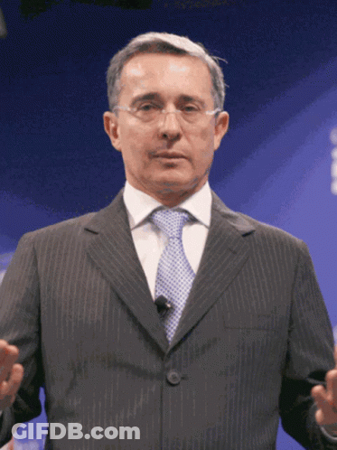 Man In Suit Giving Presentation GIF