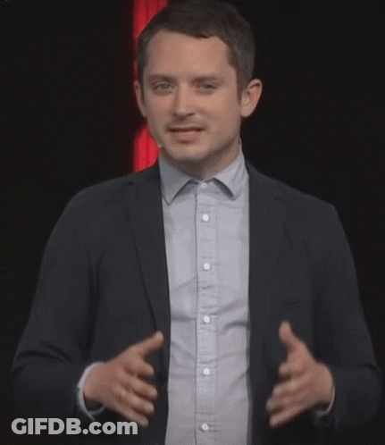 Man In Suit Giving Presentation GIF