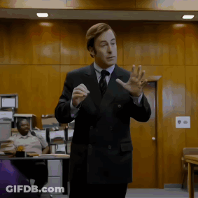 Man In Suit Giving Presentation GIF