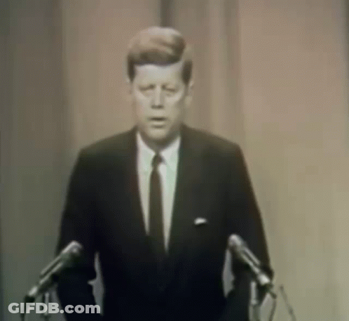 Man In Suit Giving Speech At Microphones GIF