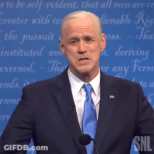 Man In Suit Giving Speech At Podium GIF