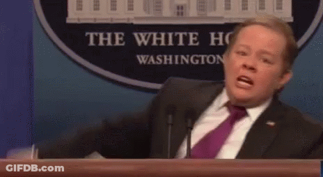 Man In Suit Giving Speech At Podium GIF