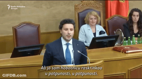 Man In Suit Giving Speech At Podium Saying Ali GIF