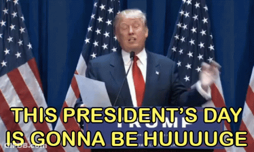 Man In Suit Giving Speech In Front Of American Flags GIF