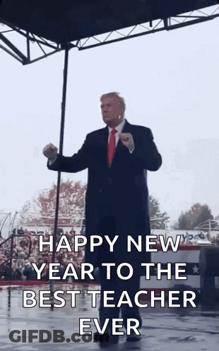 Man In Suit Giving Speech On Stage GIF