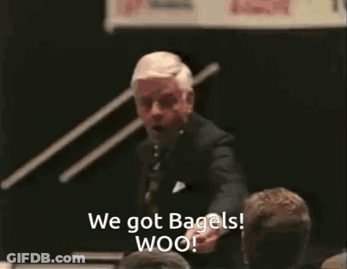 Man In Suit Giving Speech Says We Got Bagels Woo GIF