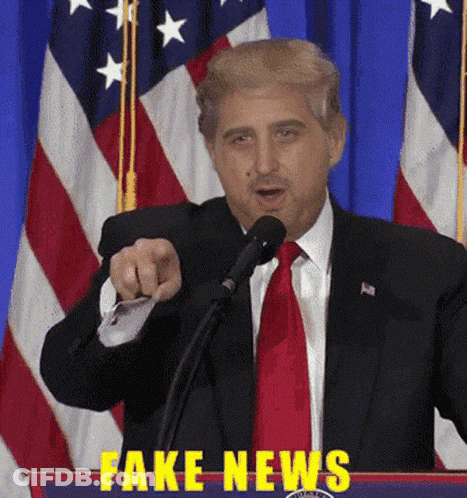 Man In Suit Giving Speech With Fake News On Podium GIF