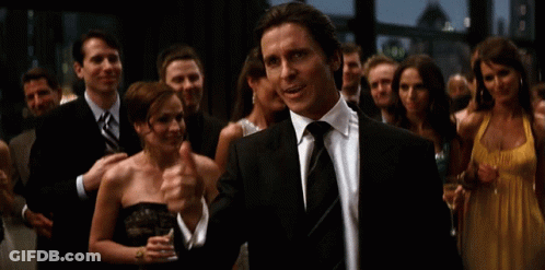 Man In Suit Giving Thumbs Up In Front Of Crowd GIF