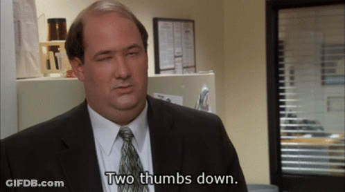 Man In Suit Giving Two Thumbs Down GIF