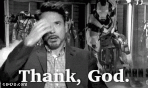 Man In Suit Hand To Face Thank God GIF