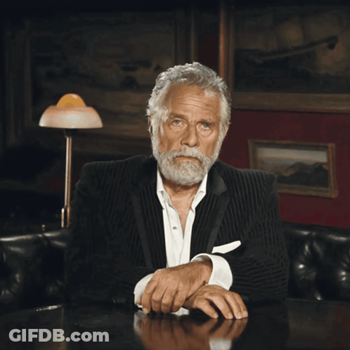 Man In Suit Hand To Face GIF