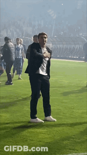 Man In Suit Hands On Chest GIF