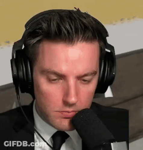 Man In Suit Headphones Talking Into Microphone GIF