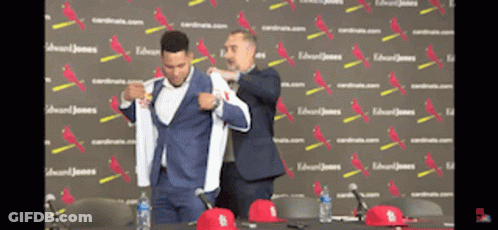 Man In Suit Helped By Another Man GIF