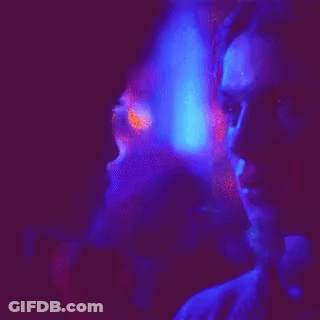 Man In Suit Helped By People In FIFA Vests GIF