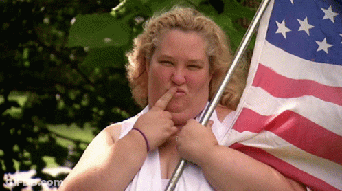 Man In Suit Holding American Flag Happy Memorial Day GIF