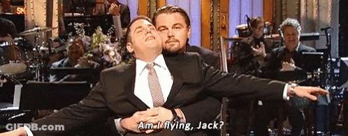 Man In Suit Holding Another Man Saying Am I Flying Jack GIF