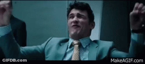 Man In Suit Holding Arms Up GIF